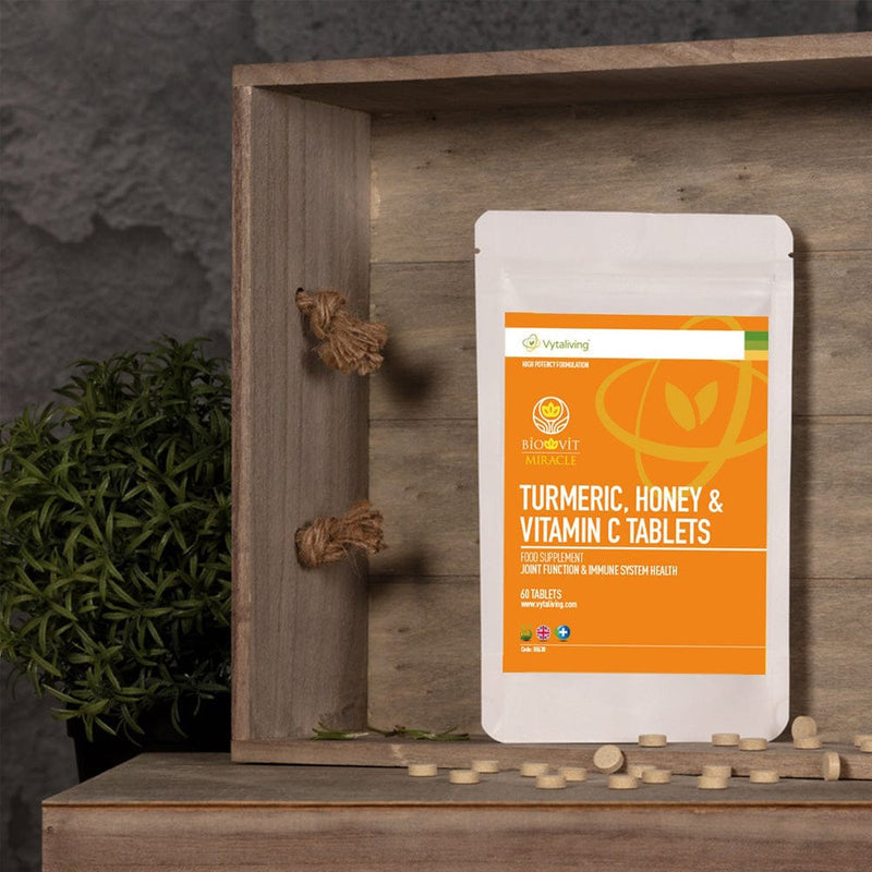 Vytaliving Biovit Turmeric, Honey and VItamin C Tablets for Joint Function and the Immune System in a wooden crate